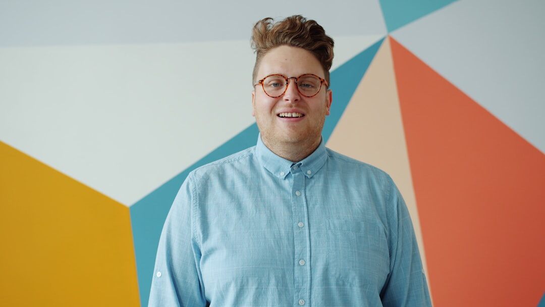 Studio portrait of a young professional man data analyst smiling