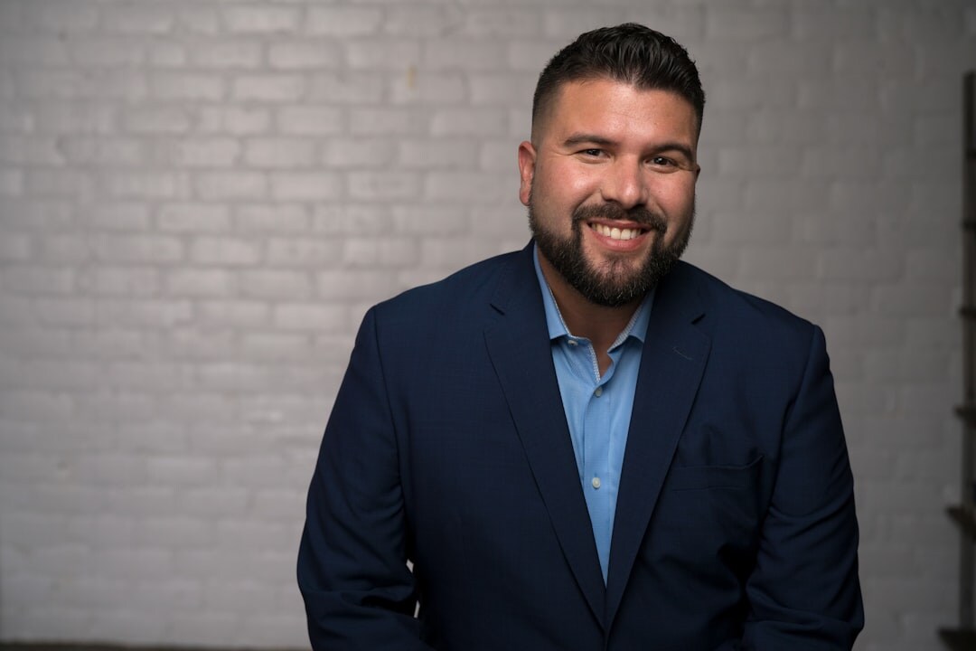 Studio portrait of a professional man in a suit smiling