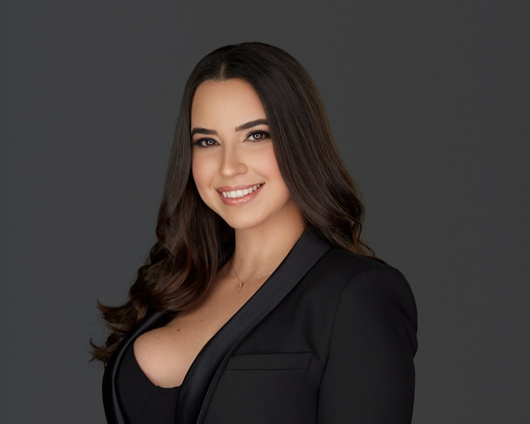 Studio portrait of a professional woman in business attire smiling